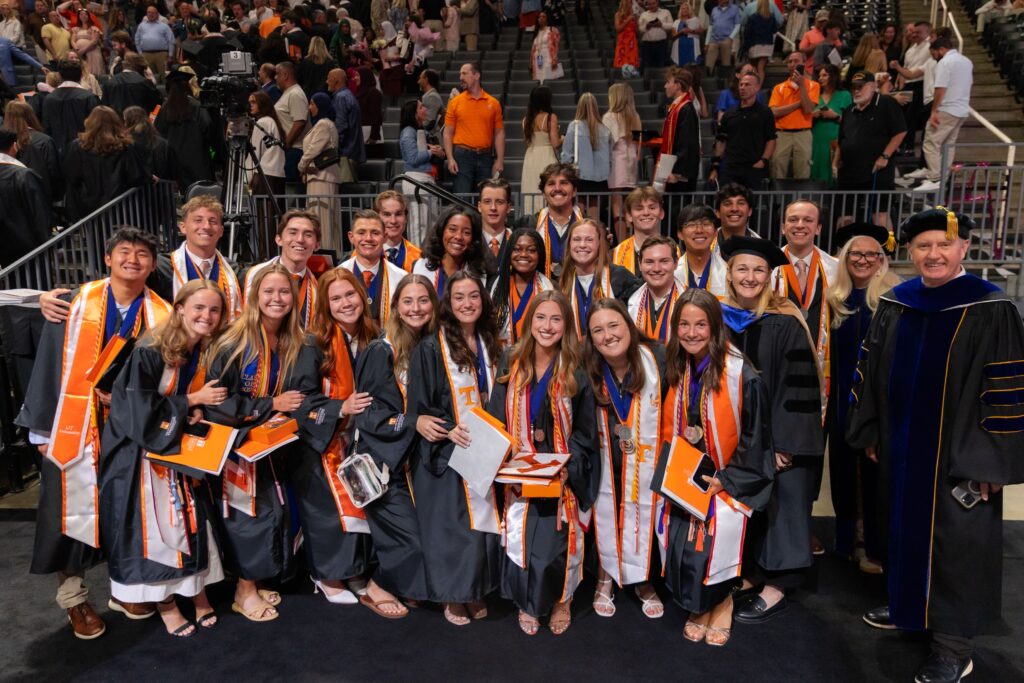 Jules with a large group of graduating Haslam students at commencement