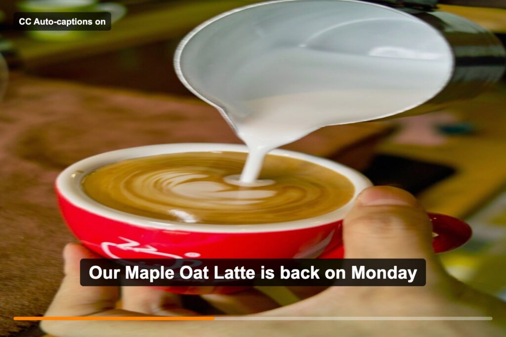 A video frame of milk being poured into a latte with the caption Our Maple Oat Latte is back on Monday