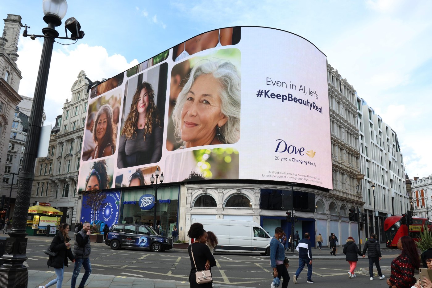 A Dove billboard in a busy city square showing a woman's portrait, from Dove's The Code campaign