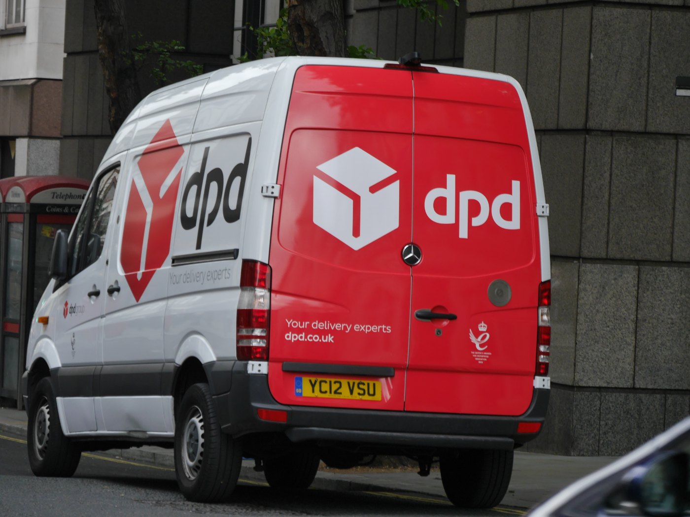 A red DPD delivery van with the DPD cube logo