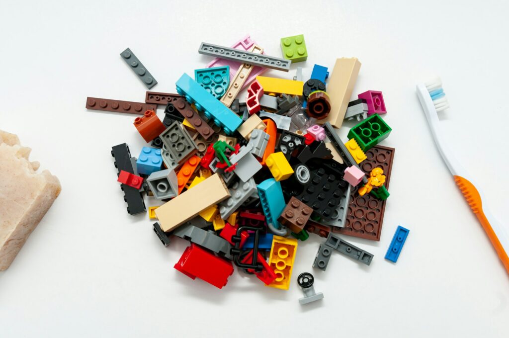 A pile of colorful building bricks on a white table
