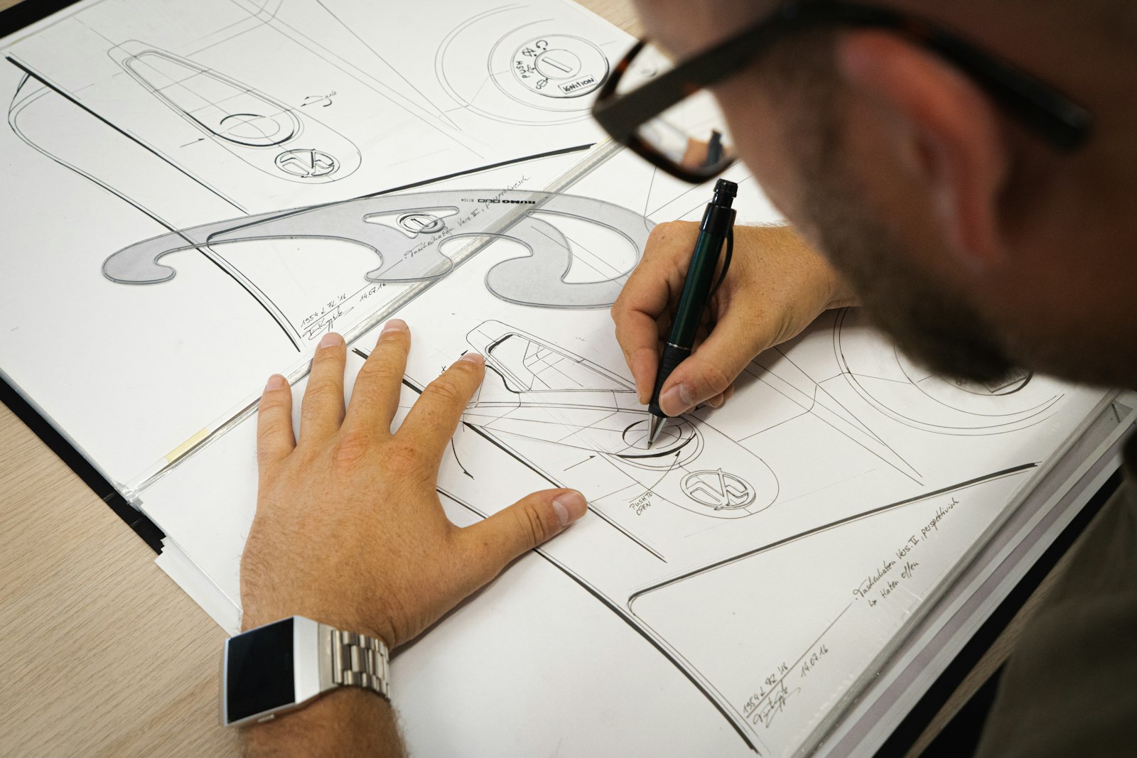 A designer sketching product prototypes by hand