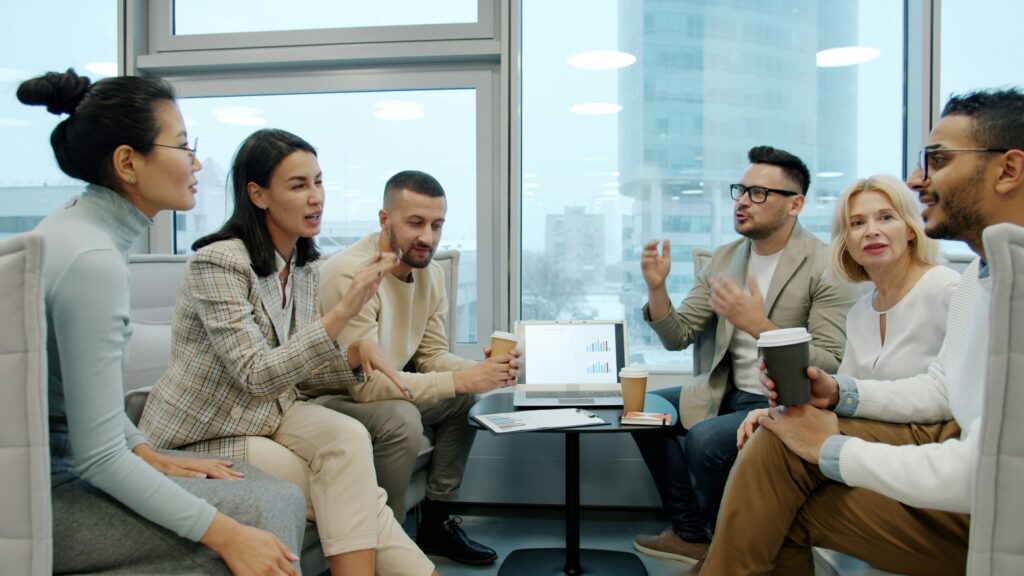 A leader guiding a team discussion in a meeting room