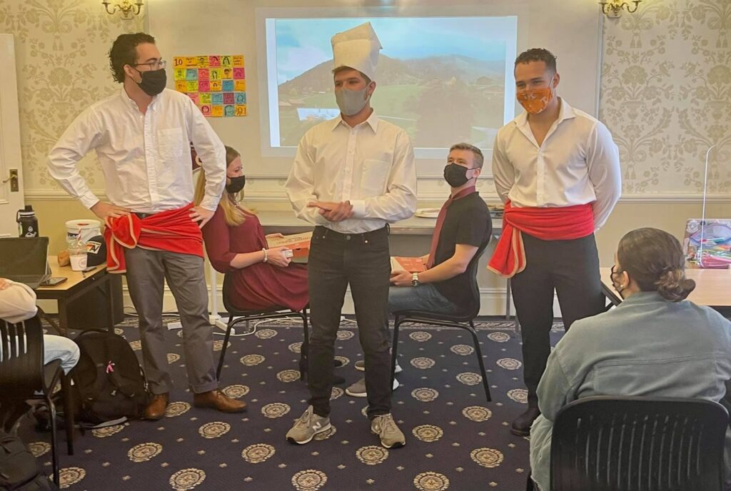 Students act out a skit as part of their final presentation