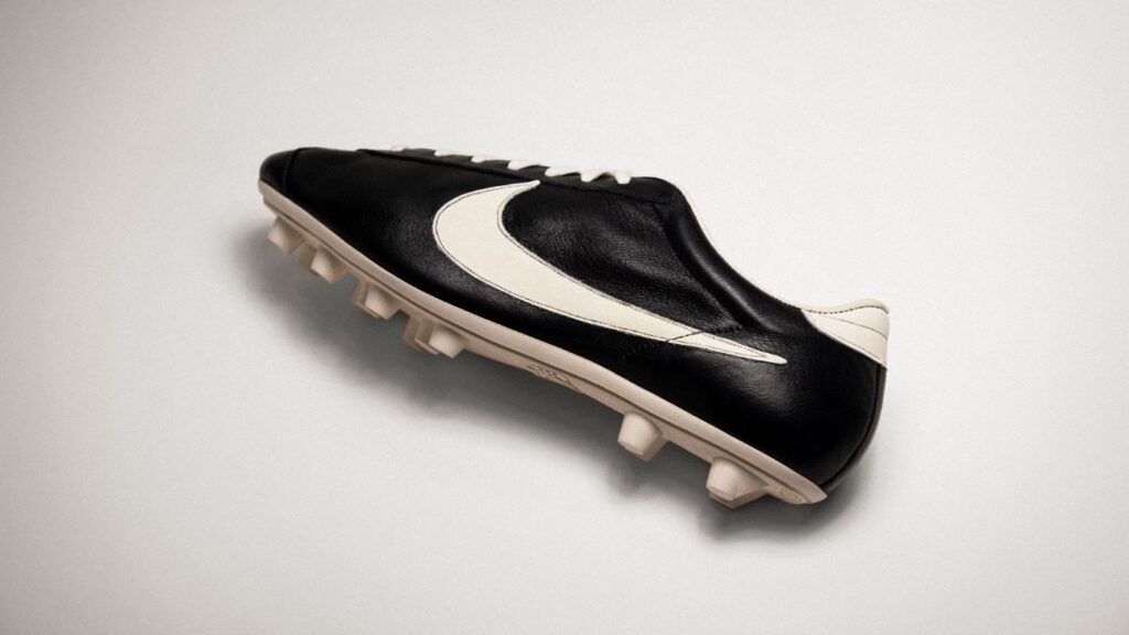 Black Nike football boot showing the swoosh logo.